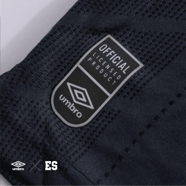 Umbro official licensed product tag.