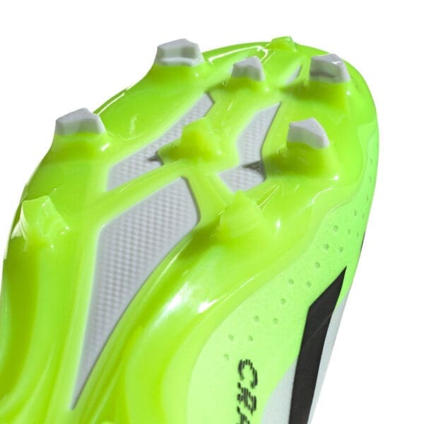 Yellow and white soccer cleat sole.