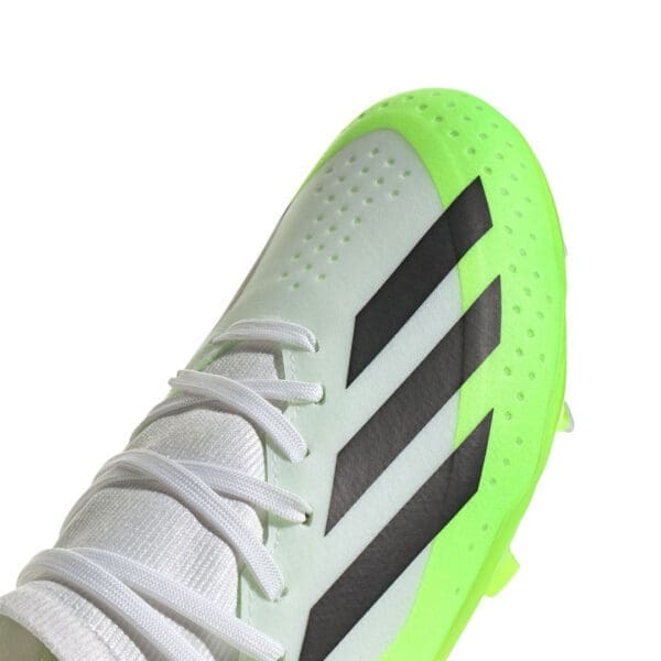 White and green Adidas soccer cleat.