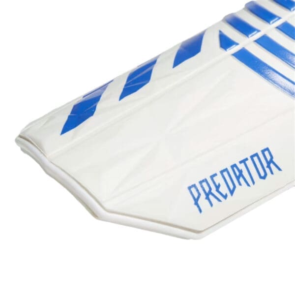 White and blue Adidas Predator glove.