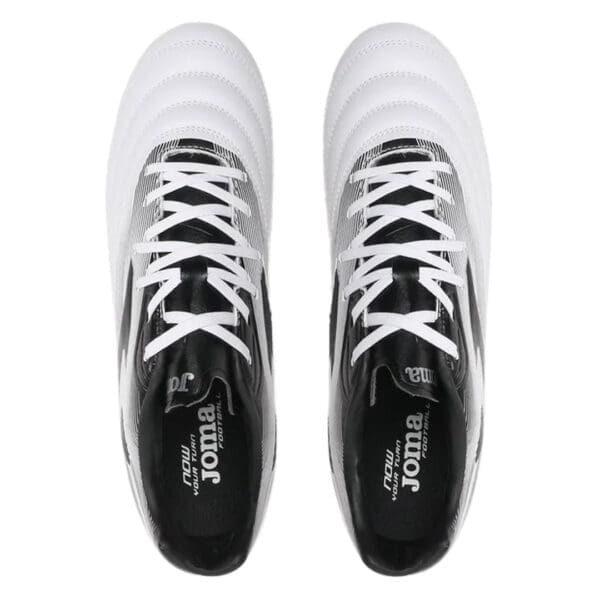 Pair of white and black Joma football boots.