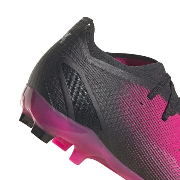 Pink and black Adidas soccer cleat.