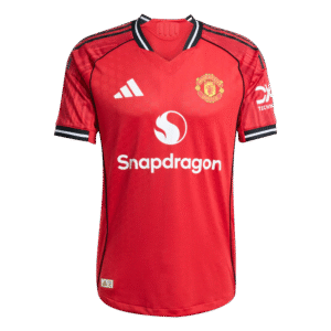 Red soccer jersey with sponsor logos displayed.