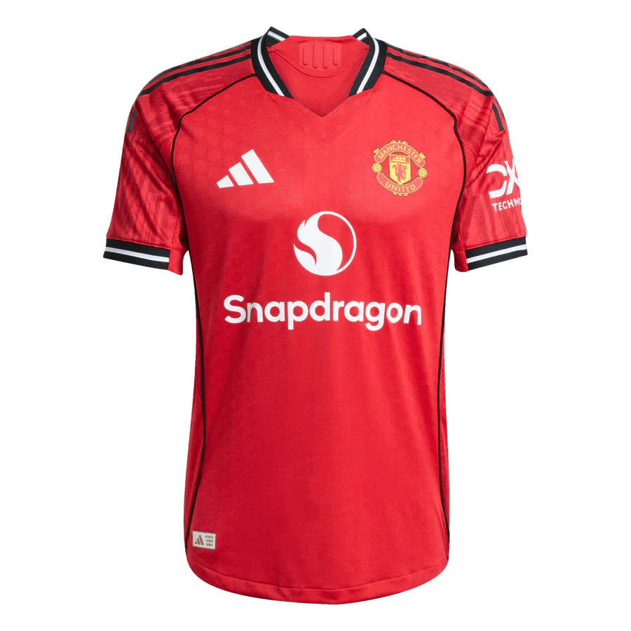 Red soccer jersey with sponsor logos displayed.